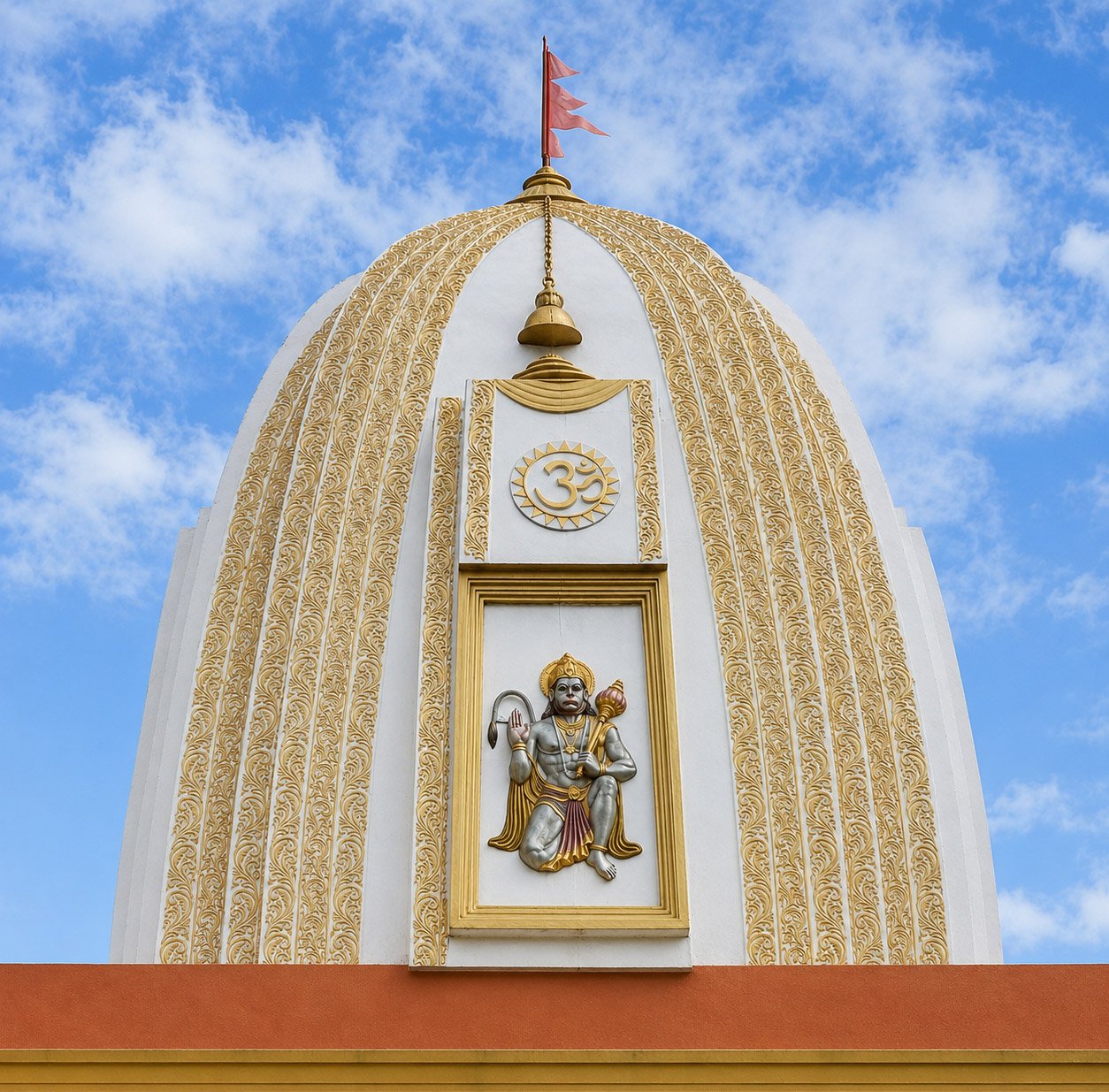 The gopuram dome of Shree Hanuman Mandir against a blue sky